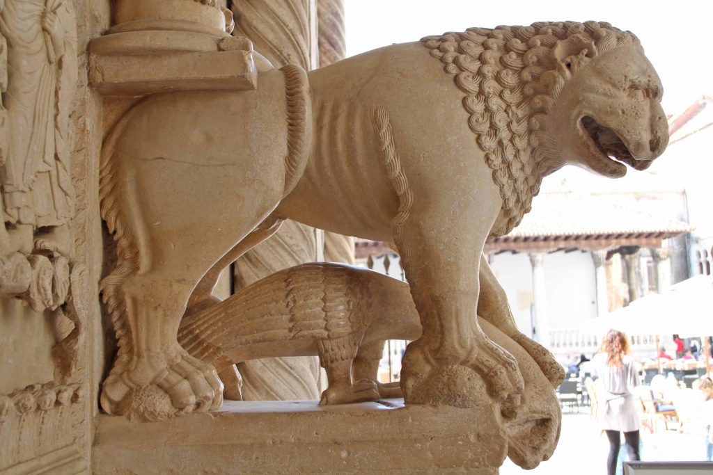 Trogir, st. Lawrence cathedral Lion next to carved doorway